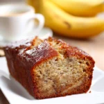Close-up of a banana cake with a light, airy texture and a clean background
