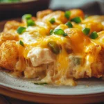 When the Craving Hits: Cheesy Chicken Tater Tot Casserole Crock Pot Comfort 3 Cheesy chicken tater tot casserole in a crock pot with golden cheese topping
