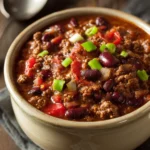Slow Cooker Chili for Those Nights You Just Want to Cozy Up 3 Close-up of chili in a slow cooker with beans and spices, warm lighting