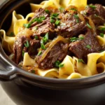 When You Need Comfort: Crock Pot Beef with Noodles for Busy Nights 3 Close-up of crock pot beef with noodles in a warm, inviting setting.