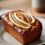 Close-up of maple banana bread with a warm, inviting texture and golden crust.