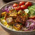 When You Need a Comforting Middle Eastern Tofu Rice Bowl Tonight 3 Close-up of a Middle Eastern Tofu Rice Bowl with vibrant vegetables and tofu on a clean background.
