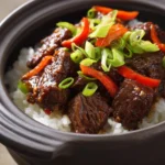 Slow Cooker Beef Teriyaki for Cozy Weeknight Dinners 3 Close-up of slow cooker beef teriyaki with a glossy sauce and garnished with sesame seeds.