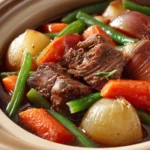 Slow Cooker Beef Vegetable Stew for Cozy Evenings at Home 3 Close-up of slow cooker beef vegetable dish with vibrant vegetables and tender beef.