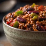 Close-up of slow cooker Texas beef chili with lean beef and green herbs