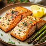 Close-up of air fryer salmon and asparagus with bright lighting and clean background