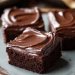 Classic Chocolate Sheet Cake Squares for Your Next Cozy Night In 3 Close-up of delicious sheet cake squares with a light, airy texture on a clean background.