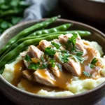Close-up of a turkey dinner bowl with vegetables and grains, bright and appetizing.