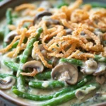 Close-up of a green bean casserole with creamy sauce and crispy topping, perfect as a freezer meal.