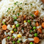 Close-up of a hearty ground beef dinner with vegetables on a white plate.