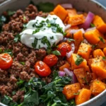Close-up of a high protein beef and sweet potato bowl with vibrant colors and fresh ingredients.