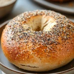Close-up of no knead bread with everything bagel seasoning on a wooden board