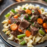 Close-up of slow cooker beef and noodles with a clean background