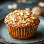 Close-up of yogurt oatmeal muffin with a golden-brown top and soft texture